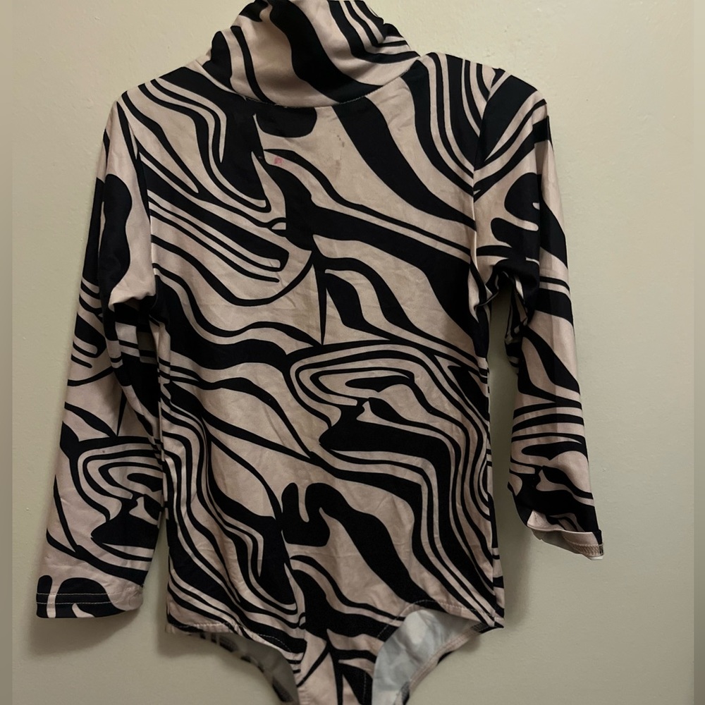 Toddler girl beige and black bodysuit